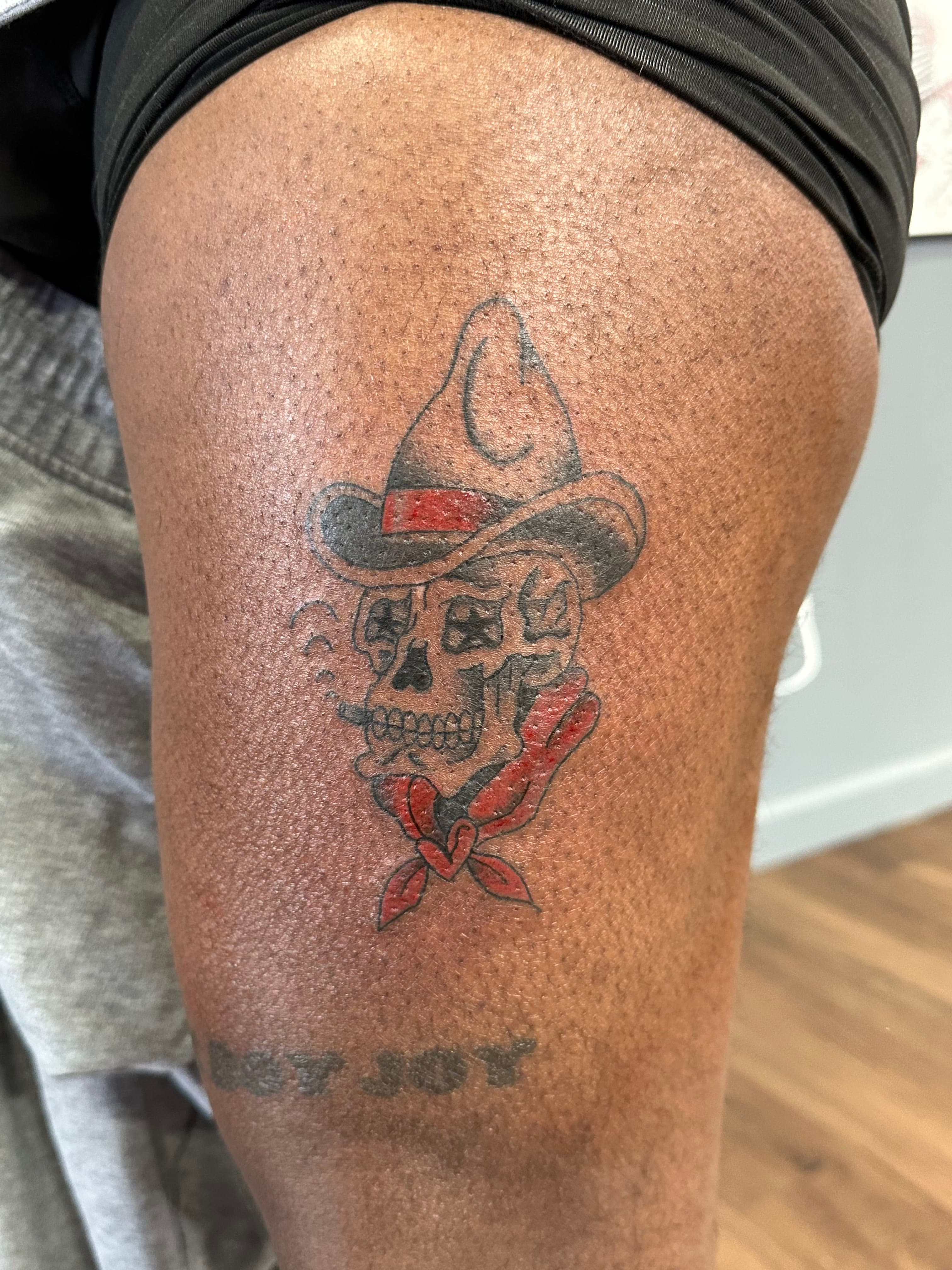 Skull dressed up like a cowboy tattoo
