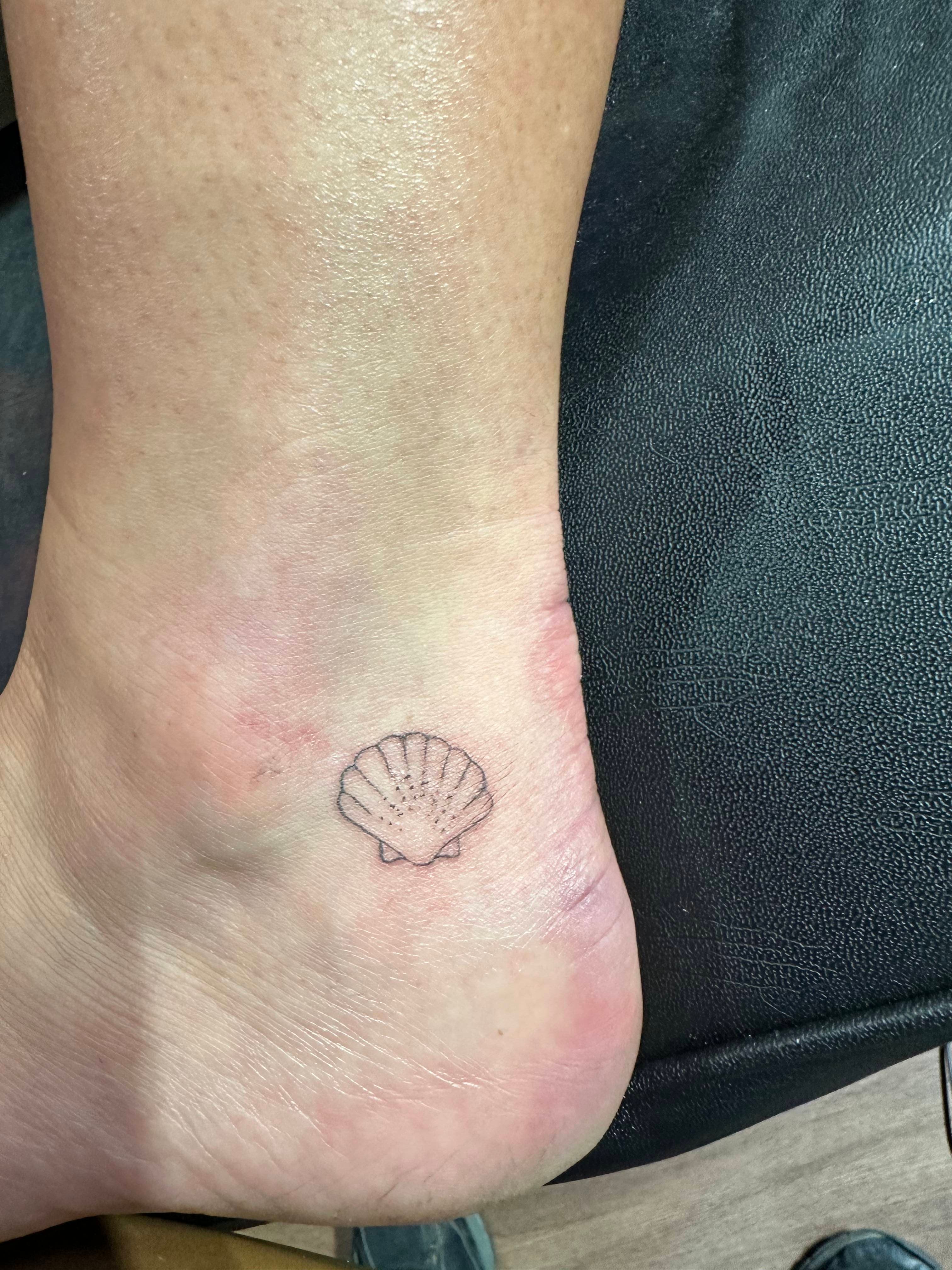 Sea shell tattoo on ankle
